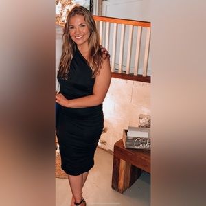 Black fitted midi dress.